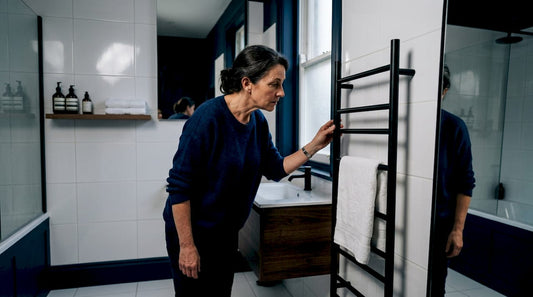 Woman examining ladder-style designer towel rail