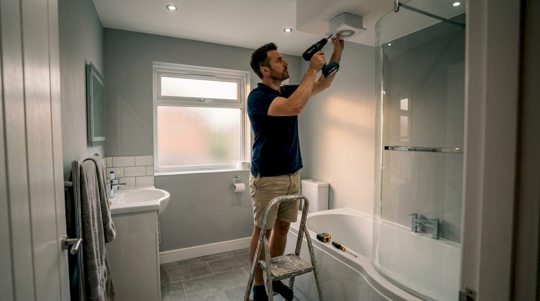UK homeowner installing bathroom extractor fan