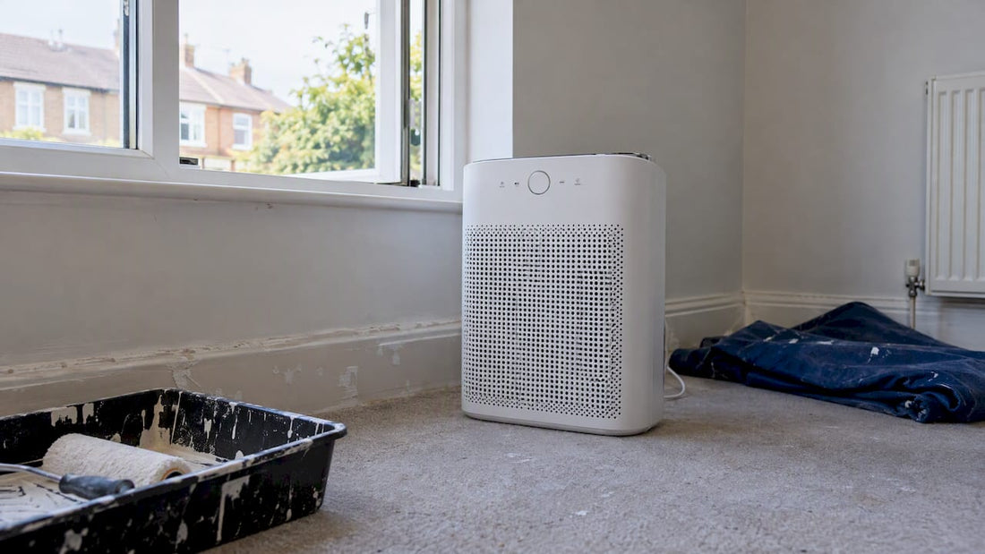 Air purifier beside an open bedroom window